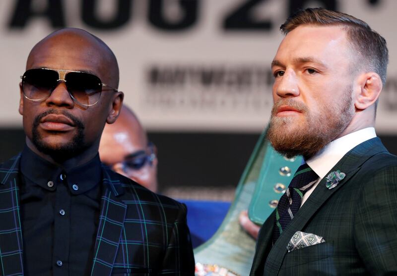 Floyd Mayweather Jr. (L) of the U.S. and UFC lightweight champion Conor McGregor of Ireland pose during a news conference in Las Vegas, Nevada U.S. on August 23, 2017. REUTERS/Las Vegas Sun/Steve Marcus