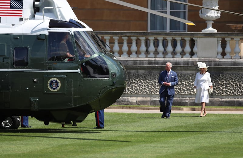 Britain's Prince Charles and Camilla, Duchess of Cornwall wait next to Marine One as U.S. President Donald Trump and First Lady Melania Trump arrive at Buckingham Palace, in London, Britain, June 3, 2019. Reuters