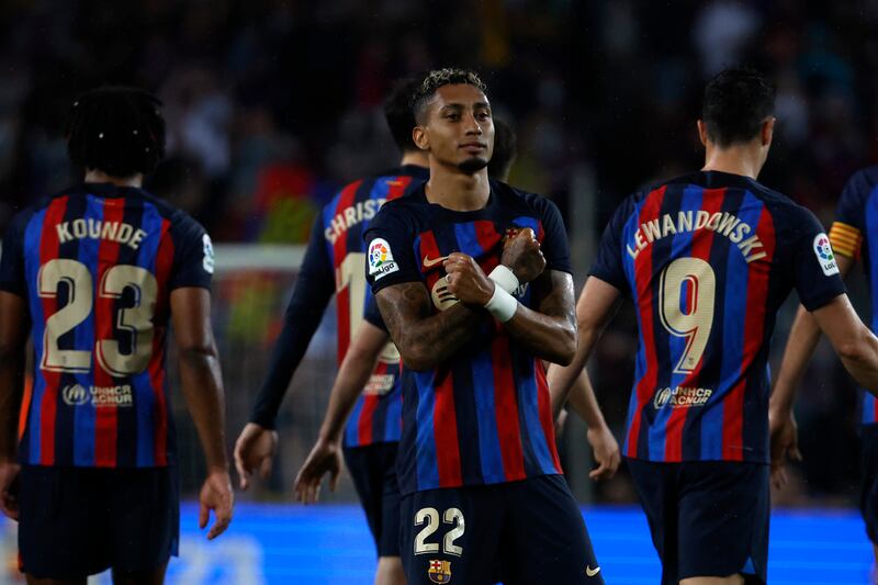 Raphinha celebrates after scoring Barcelona's third goal against Real Betis. AP