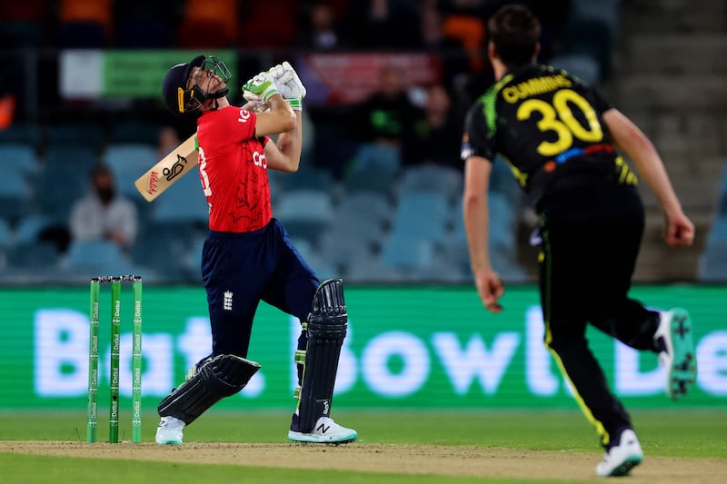 England's Jos Buttler skies a shot before being caught out. AFP