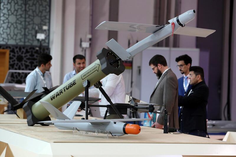 ABU DHABI, UNITED ARAB EMIRATES , Feb 23  – 2020 :- Visitors looking drones and unmanned ground vehicle which is on display at the International Golden Group stand on the first day of the UMEX & SimTEX held at Abu Dhabi National Exhibitions Centre in Abu Dhabi. (Pawan  Singh / The National) For News/Online/Instagram.  Story by Kelsey Warner