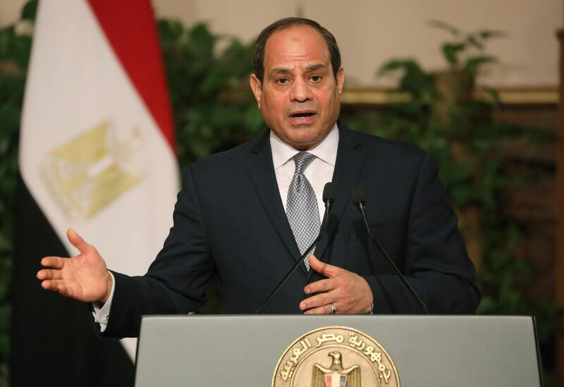 Egyptian President Abdel Fattah al-Sisi speaks during a joint press conference with his French counterpart after their meeting in Cairo on January 28, 2019. French President Emmanuel Macron called for "respect for individual freedoms" during his meeting with Sisi on his first official visit to Egypt. / AFP / Ludovic MARIN
