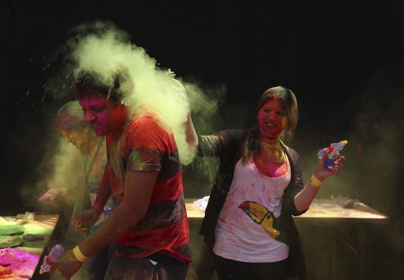 Indians throw coloured powder in Hyderabad. Mahesh Kumar A. / AP Photo