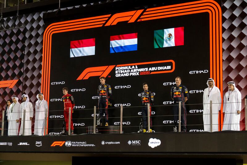Dr Al Jaber, Sheikh Khaled bin Mohamed, Mohammed ben Sulayem, president of the Fédération Internationale de l’Automobile and Mohammed Al Hammadi, chairman of the Abu Dhabi Department of Economic Development, on the winners' podium at the end of the Abu Dhabi Grand Prix with winner Max Verstappen, runner up Charles Leclerc and third placed Sergio Perez. Photo: Mohamed Al Hammadi / UAE Presidential Court