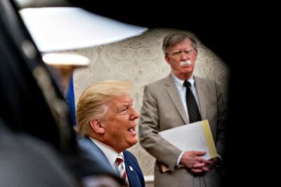 epa08493524 (FILE) - US President Donald Trump speaks as John Bolton, national security advisor, listens during his meeting with Klaus Iohannis, Romania's president, not pictured, in the Oval Office of the White House in Washington, DC, USA, 20 August 2019 (reissued 18 June 2020). According to media reports, the US government wants to prevent publication of a book by former National Security advisor Bolton, arguing that national security was at risk.  EPA/Andrew Harrer / POOL *** Local Caption *** 55406002