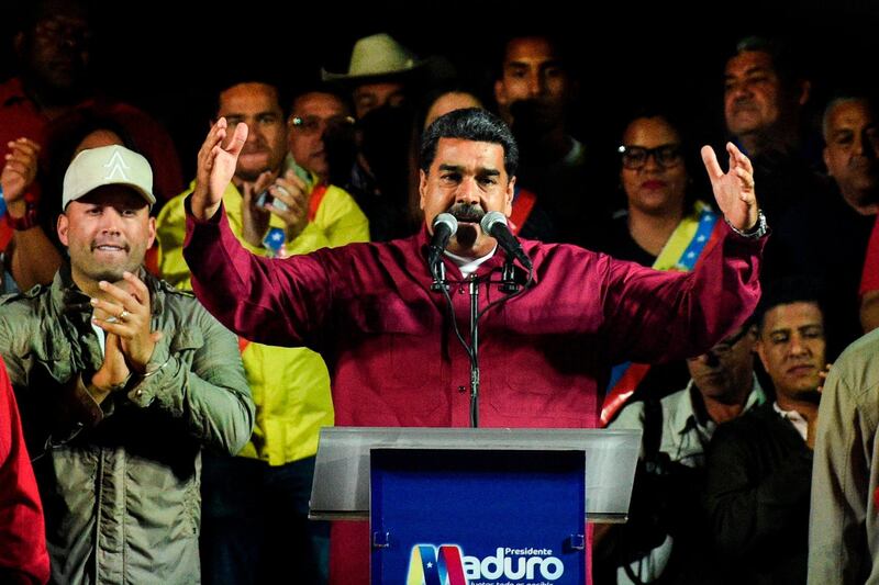 Venezuelan President Nicolas Maduro addresses supporters after the National Electoral Council announced the results of the voting on election day in Venezuela, in Caracas. Federico Parra / AFP