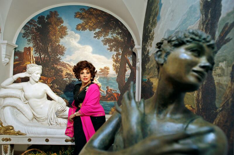 Lollobrigida with two of her sculptures in her Rome villa in 2006. Reuters