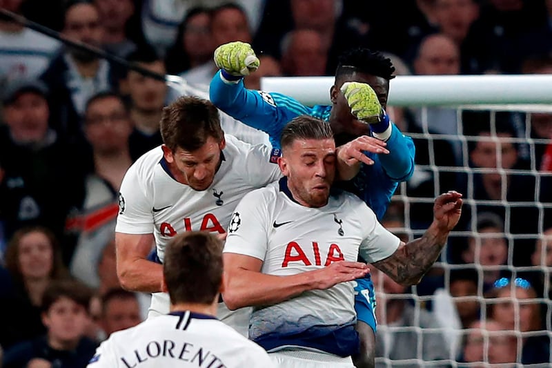 Tottenham Hotspur defender Jan Vertonghen, left, is injured after colliding with teammate Toby Aldewiereld during Tuesday's 1-0 defeat to Ajax in the first leg of the Champions League semi-final in London. The Belgian defender required lengthy medial treatment for a facial injury. AFP