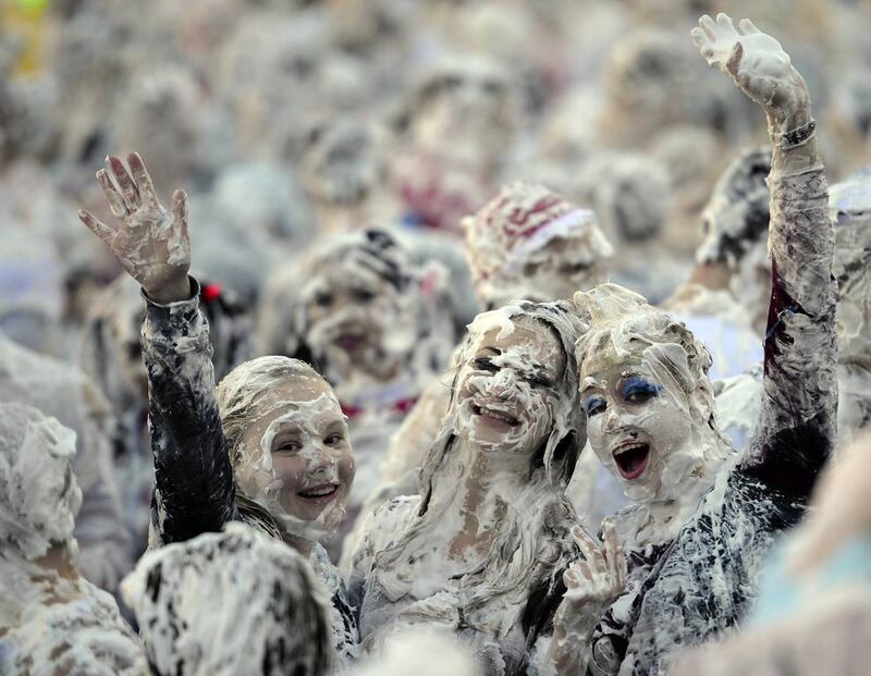 Students from St Andrews University are covered in foam as they take part in the traditional ‘Raisin Weekend’ in the historic St Salvator’s Quad, in St Andrews, Scotland, on November 4, 2013. Russell Cheyne / Reuters