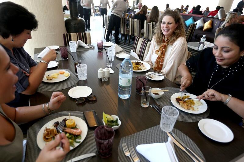Jessica Jung, second from right, Chayanne Perera, right, Victoria Scherfner, left and Claire Sneddon enjoy brunch together at Silk Route Cafe at the Holiday Inn in Abu Dhabi. Sammy Dallal / The National