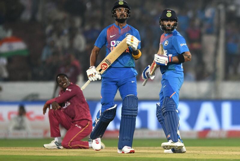 Virat Kohli, right, and KL Rahul hit sparkling fifties to secure victory against the West Indies at the Rajiv Gandhi International Cricket Stadium. AFP