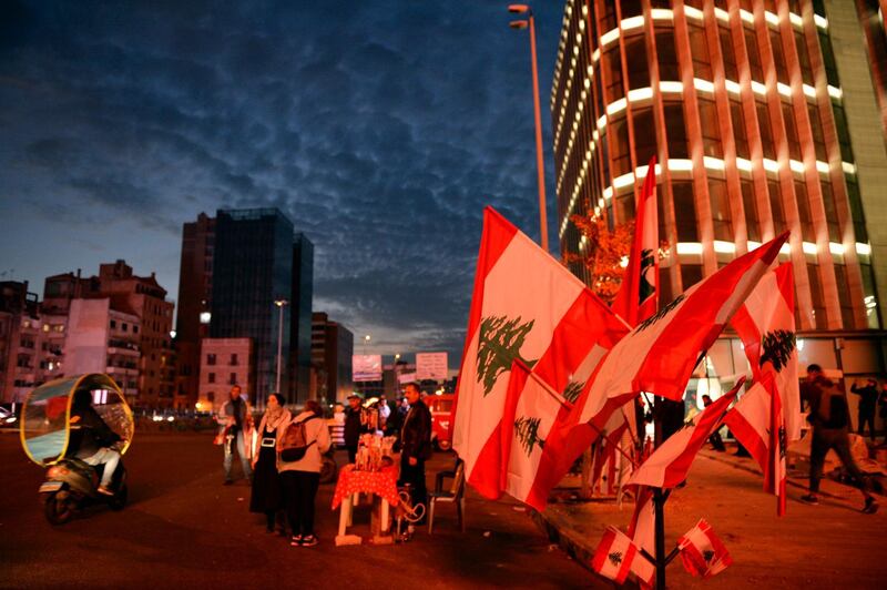 A vendor sells national flags on the Ring Bridge in Beirut. EPA