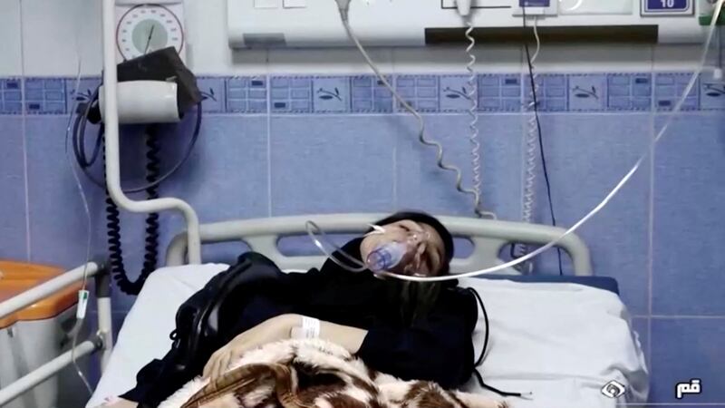 A young woman lies in hospital after reports of poisoning at an unspecified location in Iran in this still image from video from March 2, 2023.  WANA/Reuters T