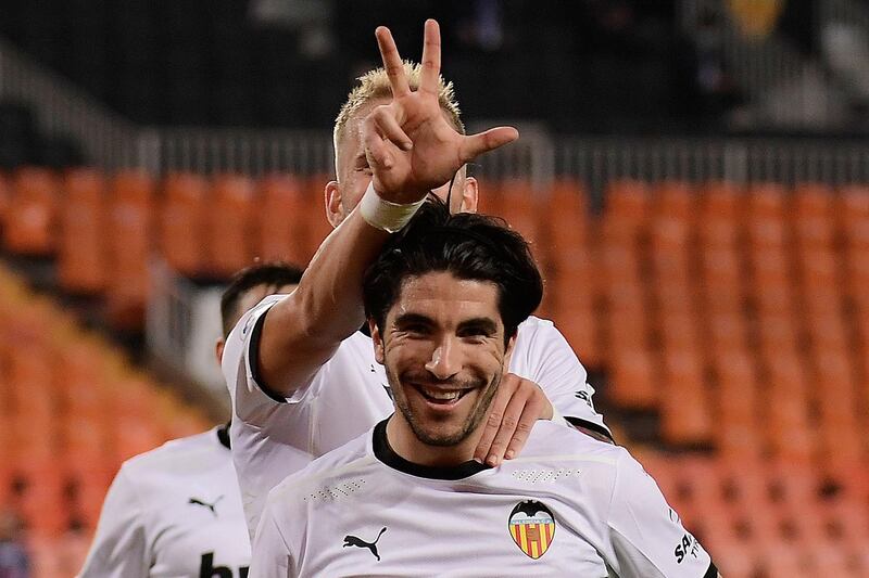 Valencia's Spanish midfielder Carlos Soler celebrates after scoring his third penalty in the 4-1 thrashing of Real Madrid. AFP