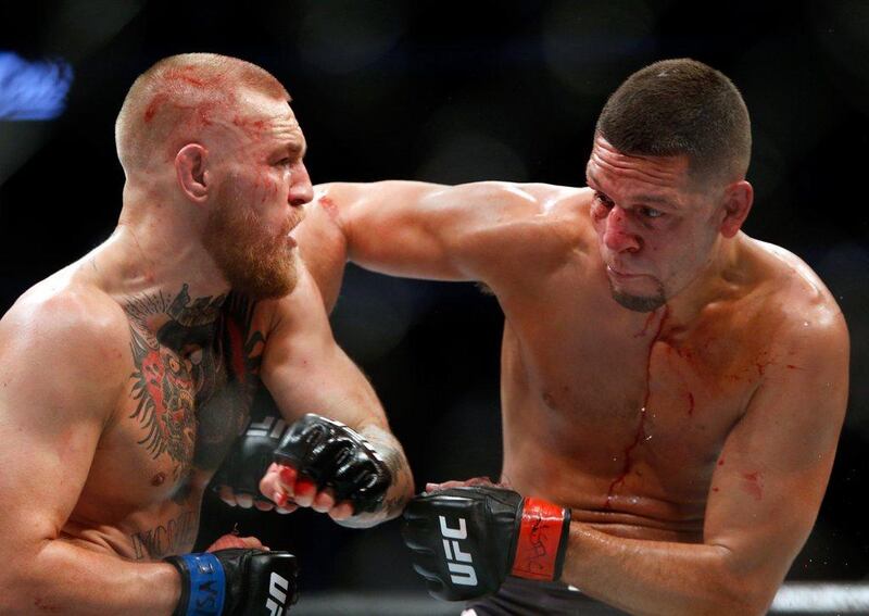Conor McGregor and Nate Diaz battle during their welterweight rematch at UFC 202. AFP