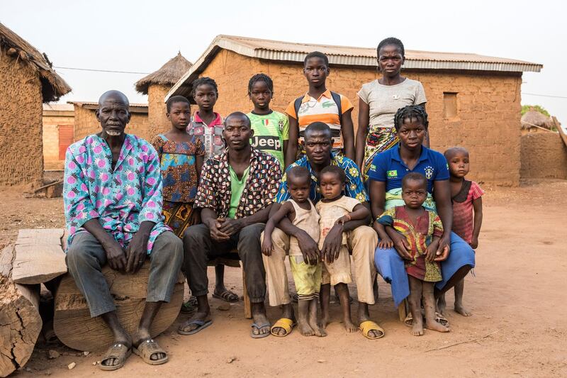 STRICTLY NO USE BEFORE 05:00 GMT (09:00 UAE) 18 JUNE 2020

Ngolo Silué (left) sits for a family portrait with his sons, Yeo (centre-left) and Silue (centre-right), and his daughters Yrei (right, front) and Nawa (right, rear) in the village of Olleo, home to 3,000 people and located 30 kilometres along a dirt track from the provincial capital. Thanks to a visit by the Côte d’Ivoire Women’s Legal Aid Association, the Silué family, all formerly undocumented, have started the process of obtaining identity papers that will help them apply for jobs, access state healthcare and get driver’s licences. ; In Olleo, northern Côte d’Ivoire, hundreds of villagers without documents attended a meeting organised by the Côte d’Ivoire Women’s Legal Aid Association. UNHCR has supported their four-year campaign, encouraging people without documents – many of them illiterate – to register and protect their rights. Generations of families in this isolated community have found registering their children’s births a challenge. To obtain full nationality papers is costly, time-consuming and depends on the decision of a judge. Because of this, many in Olleo have never pursued documentation, don’t have Ivorian citizenship, and are at risk of statelessness, along with 700,000 other people in a country of 25 million. Among them are foundlings, abandoned by families because their mothers died giving birth, and the Fula people, considered of Burkinabé origin and ineligible for Ivorian citizenship even if multiple generations were born here. The lack of papers brings fear and confines many to their villages. Worldwide, millions of stateless people face challenges accessing basic rights. UNHCR is committed to ending statelessness.