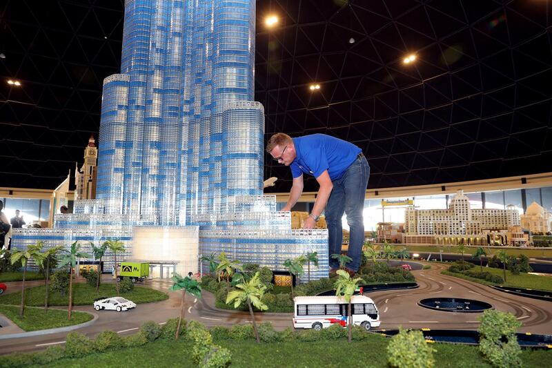 Dubai, United Arab Emirates - November 29th, 2017: PHOTO PROJECT. James Bailey inspects the lego buildings in Mini land. Wednesday, November 29th, 2017 at Legoland, Dubai. Chris Whiteoak / The National