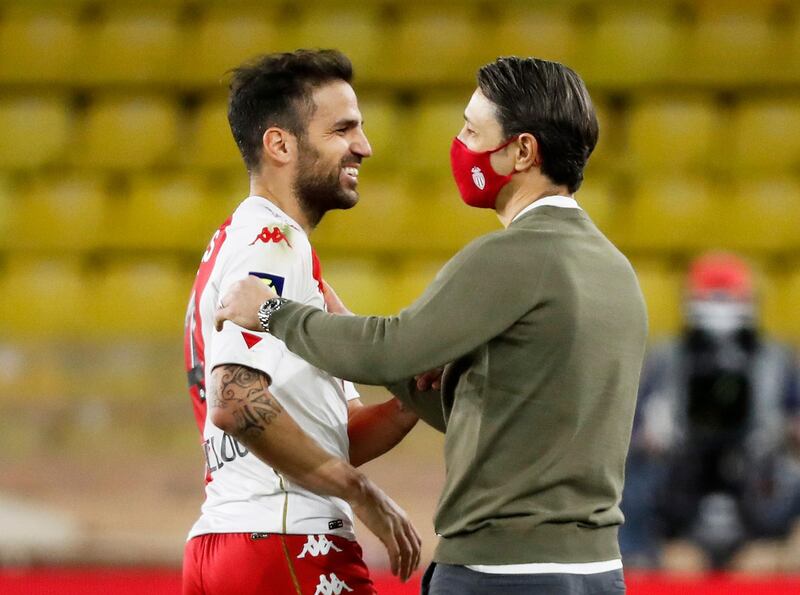 Monaco coach Niko Kovac celebrates after the match with Cesc Fabregas. Reuters