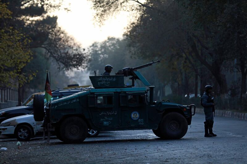 Afghan police patrol at the site of an attack at Kabul University in Kabul. AP Photo