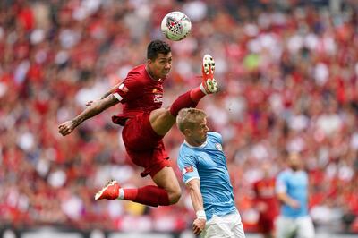 epa07756811 Liverpool's Roberto Firmino (L) in action against Manchester City's Oleksandr Zinchenko (R) during the FA Community Shield soccer match between Liverpool FC and Manchester City at Wembley Stadium in London, Britain, 04 August 2019.  EPA/WILL OLIVER EDITORIAL USE ONLY. No use with unauthorized audio, video, data, fixture lists, club/league logos or 'live' services. Online in-match use limited to 120 images, no video emulation. No use in betting, games or single club/league/player publications.