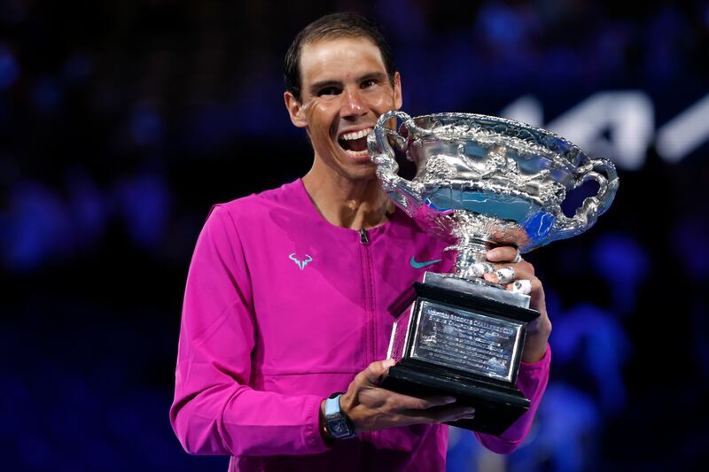 Rafael Nadal of Spain holds the Norman Brookes Challenge Cup after defeating Daniil Medvedev of Russia in the men's singles final at the Australian Open tennis championships in Melbourne, Australia, early Monday, Jan.  31, 2022.  (AP Photo / Hamish Blair)