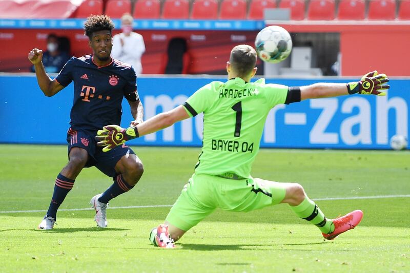 Bayern Munich forward Kingsley Coman scores his team's first goal past Bayer Leverkusen goalkeeper Lukas Hradecky. Getty Images