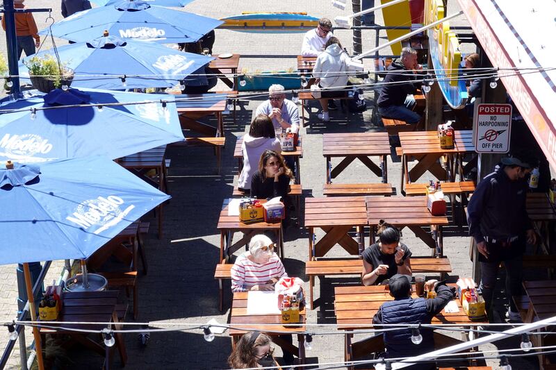 Diners in San Francisco, California. With prices so high, many US consumers say they are cutting back on eating out. AFP