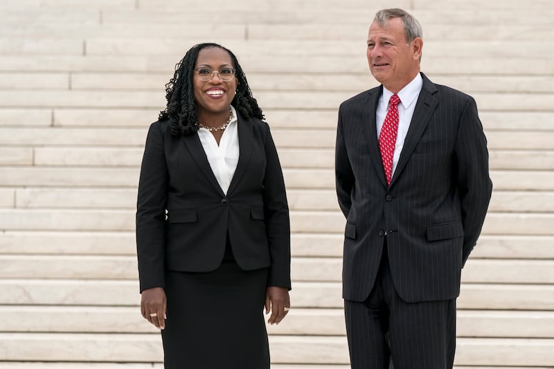 Ms Brown Jackson, seen here with Chief Justice John Roberts, is the first black woman on the US Supreme Court. AP 