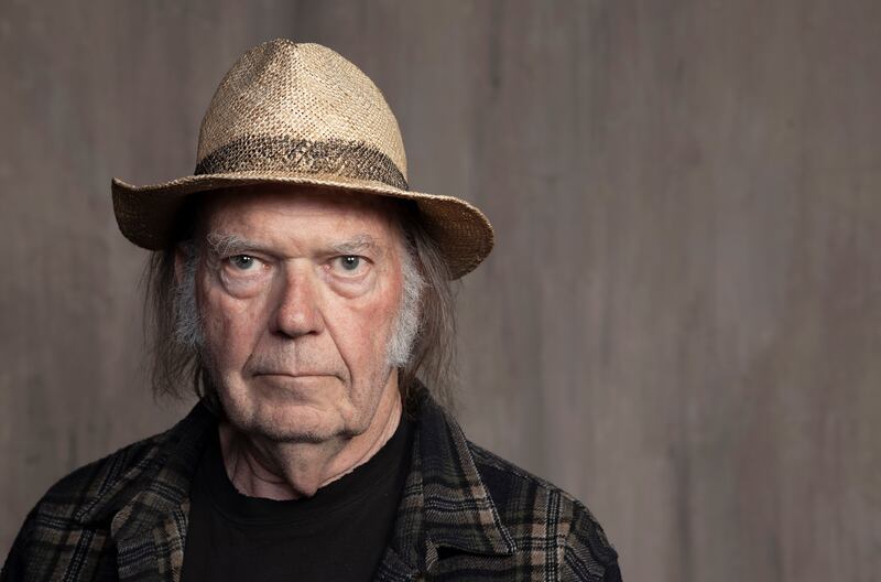 Neil Young, who accused Rogan of spreading Covid-19 misinformation, was one of the first musicians to take his music off Spotify. AP