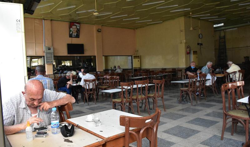 Customers sit at a cafe in Damascus, Syria. EPA