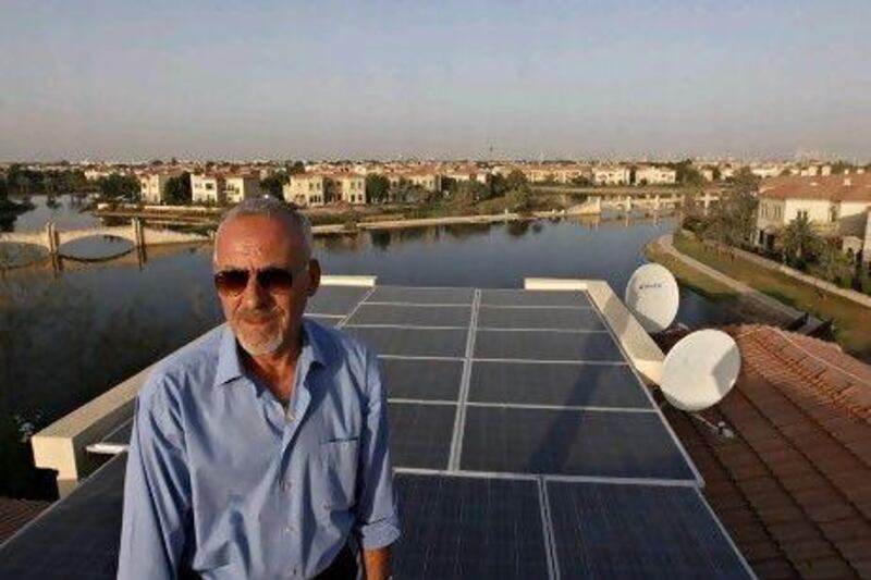 Tony Caden on the roof of his Jumeirah Islands home, where he has installed 38 solar panels. Jeff Topping / The National
