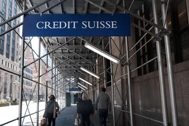A Credit Suisse sign in New York. The investment bank could suffer losses of as much as $4 billion due to its exposure to Archegos AFP