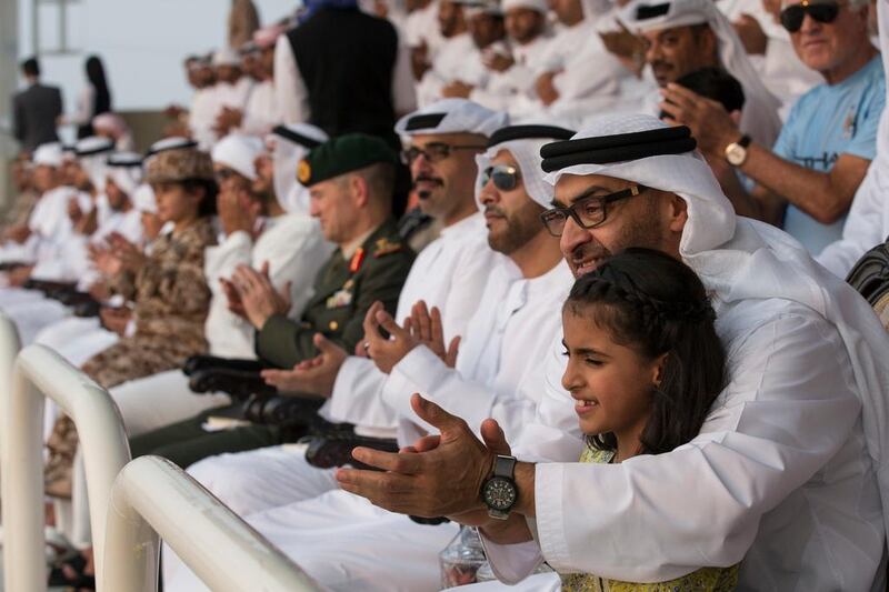 Sheikh Mohammed bin Zayed, Crown Prince of Abu Dhabi and Deputy Supreme Commander of the Armed Forces, at the graduation ceremony with his granddaughter Sheikha Salama bint Mohammed bin Hamad bin Tahnoon Al Nahyan.