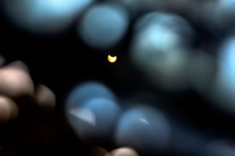 The Moon partially obscuring the Sun as seen from Gaza city. AFP