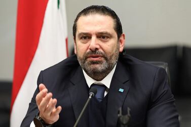 Lebanon’s outgoing Prime Minister Saad Hariri gestures during his meeting with his parliamentary bloc, in Beirut, Lebanon. Dalati Nohra via AP