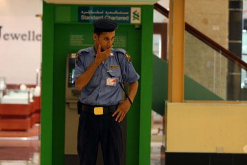 Should security guards in the UAE be armed? Police say not, but some employed in the industry say they feel 'helpless'.