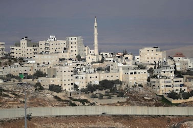 A picture taken on September 27, 2018, from the east Jerusalem Arab neighbourhood of Issawiya shows a view of the Palestinian Shuafat refugee camp and the controversial Israeli separation wall. AFP