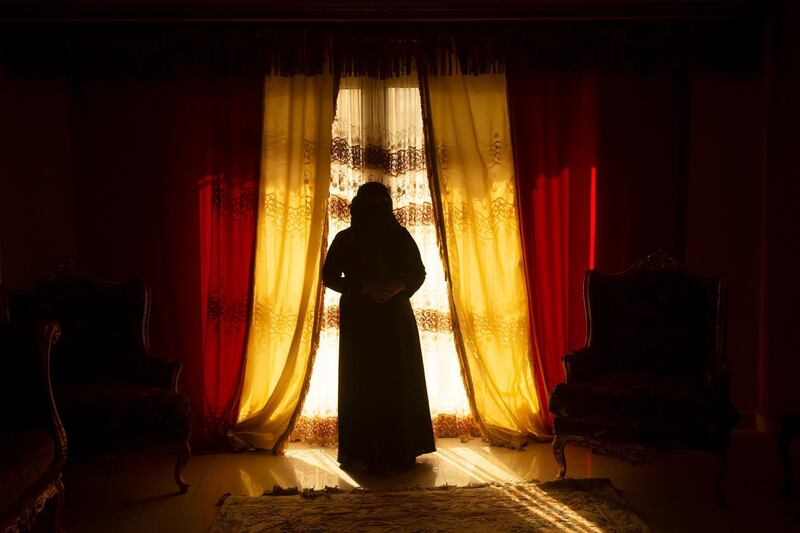 Bardis Assayaghi, who was detained by Houthis in Yemen, poses for a portrait in her home near Cairo, Egypt. AP