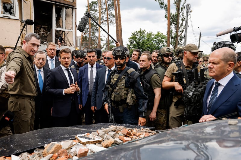 Mr Draghi (2nd-L), Romanian President Klaus Iohannis (3rd-L), Mr Macron (fourth-L) and Mr Scholz (R). EPA 