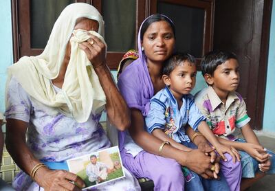 AMRITSAR, INDIA  JUNE 18: Chawinda Devi Village resident Jeeto along with her daughter in Law Seema weep after news that her son Sonu is reportedly abducted in the troubled city of Mosul in Iraq, on June 18, 2014 in Amritsar, India. Forty Indian construction workers have been kidnapped from the militant-controlled city of Mosul in northern Iraq. Most of the boys from Amritsar and surrounding villages are between the ages of 25 to 35 and lived in Mosul. Most of them worked with a construction company there. The government has received information about the location of 40 Indian construction workers abducted in strife-torn northern Iraq, external affairs ministry spokesperson Syed Akbaruddin said on Friday. External affairs minister Sushma Swaraj earlier said the government would leave no stone unturned to free the Indian workers being held in the Iraqi city of Mosul. (Photo by Sameer Sehgal/Hindustan Times via Getty Images)