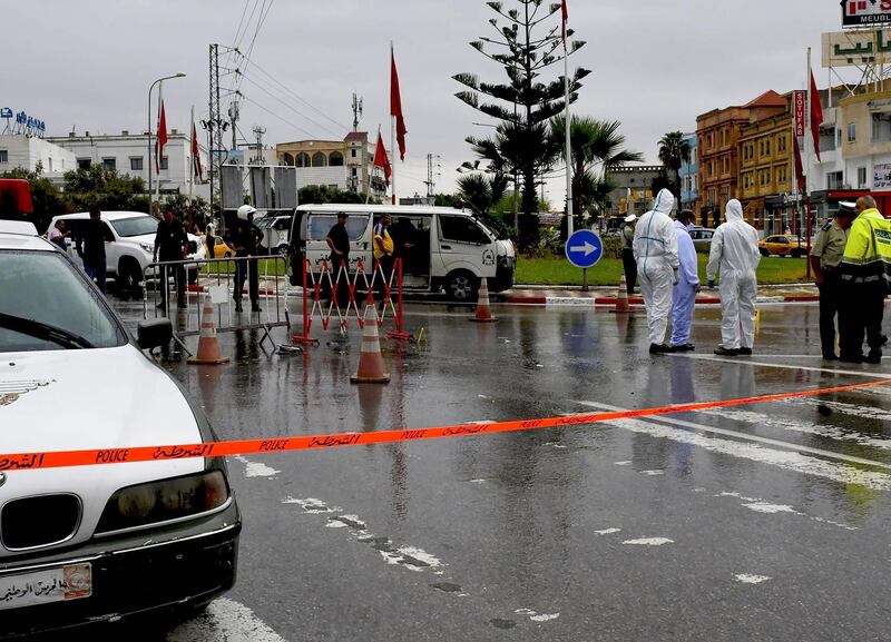 Tunisian forensic police investigate the site of an attack on Tunisian National Guard officers, in Sousse, south of the capital Tunis.  AFP