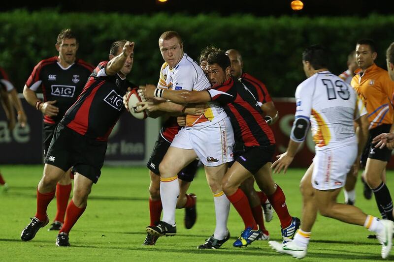 The Dubai Exiles, in black, have signalled their intentions to rejoin the elite of Middle East rugby by announcing the appointment of a new director of rugby. Pawan Singh / The National