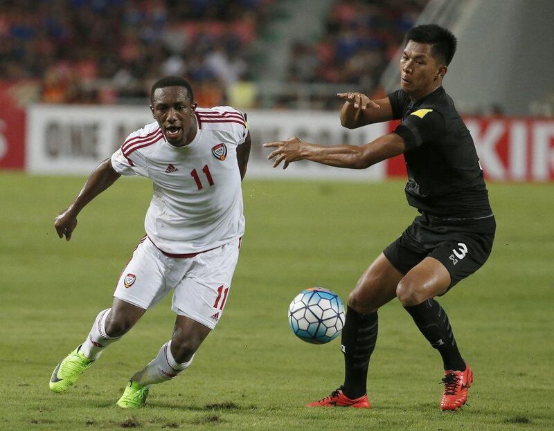 UAE striker Ahmed Khalil, left, and Thailand's Pansa Hemviboon battle for the ball during their 2018 World Cup qualifier at Rajamangala Stadium in Bangkok, Thailand, Tuesday, June 13, 2017. Sakchai Lalit / AP Photo