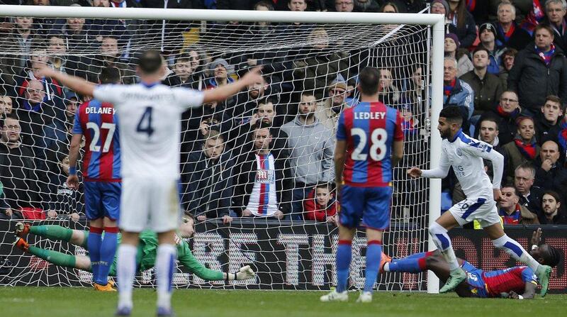 Leicester’s Riyad Mahrez, right, scores during the Premier League match between Crystal Palace and Leicester City at Selhurst Park stadium in London, Saturday, March 19, 2016. (AP Photo/Frank Augstein)