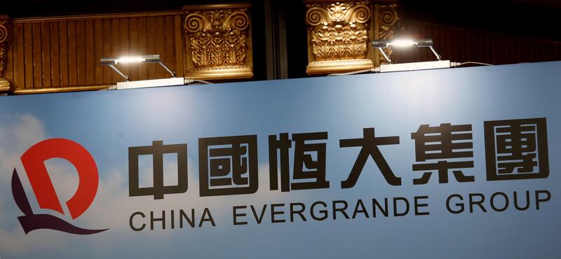 FILE PHOTO: A logo of China Evergrande Group is displayed at a news conference on the property developer's annual results in Hong Kong, China March 28, 2017. REUTERS/Bobby Yip/File Photo