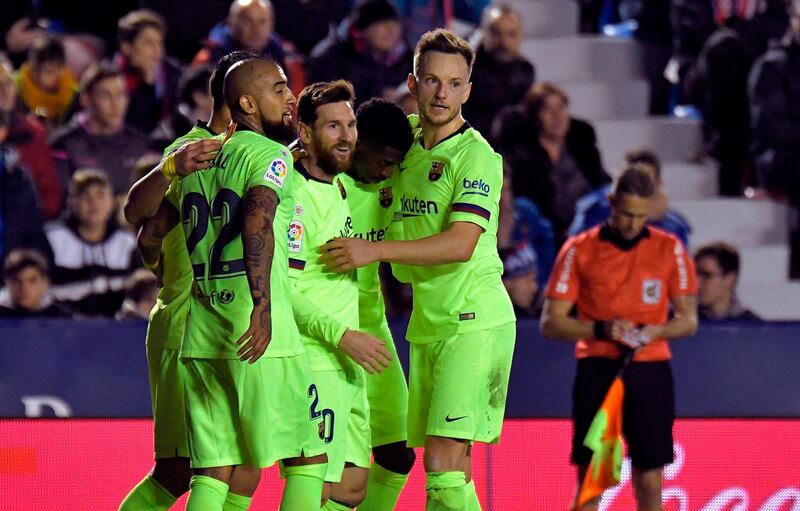 Lionel Messi celebrates a goal with teammates. AFP