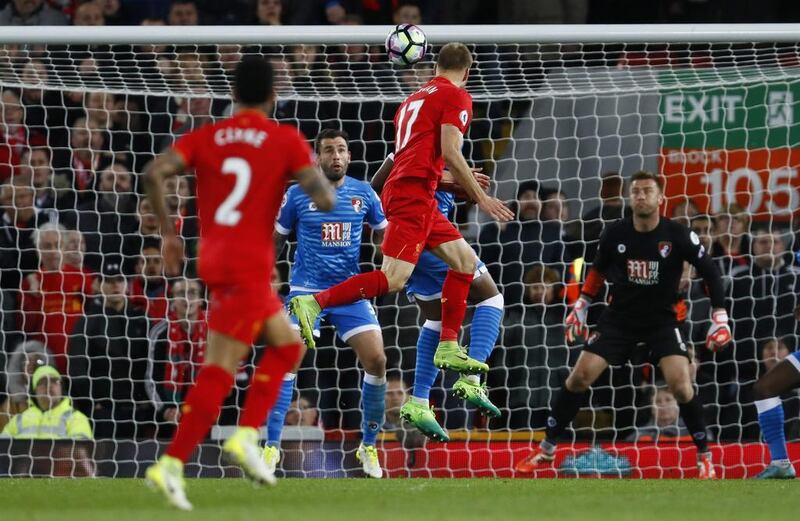 Liverpool's Ragnar Klavan shoots at goal as Bournemouth's Artur Boruc looks on. Jason Cairnduff / Reuters