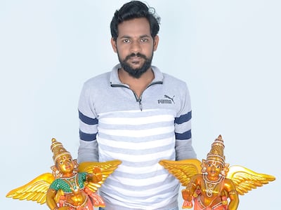 Santoshkumar Chitragar with two of his handmade figurines. Kinnalart