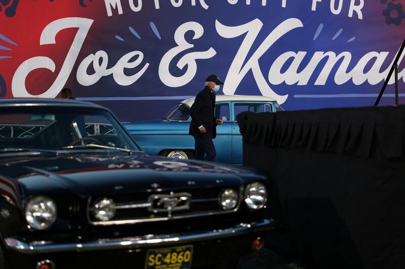 US Democratic presidential candidate Joe Biden walks towards a stage to deliver remarks during a voter mobilization event at the Michigan State Fairgrounds in Novi, Michigan. Reuters