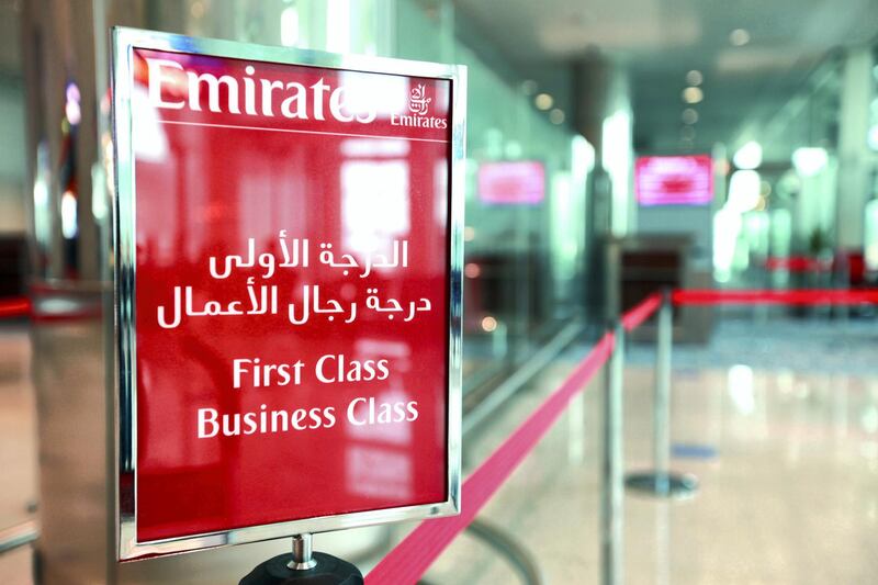 A sign for the Emirates airlines first and business class is seen inside terminal 3 at concourse A, the new A380 terminal at Dubai International Airport in Dubai, United Arab Emirates, on Monday, Feb. 25, 2013. Dedicated for use by Emirates Airline the terminal 3 complex includes an associated airside facility known as Concourse B and a purpose-built facility for Airbus A380 known as Concourse A. Photographer: Gabriela Maj/Bloomberg 
